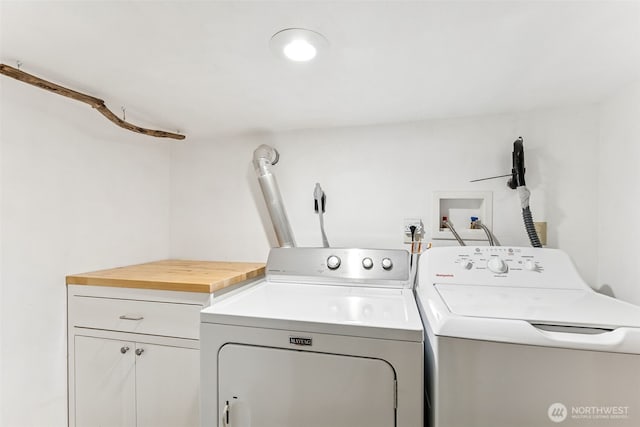 232 N Sunset Dr, Camano Island, WA 98282 - washroom featuring washing machine and clothes dryer and cabinet space