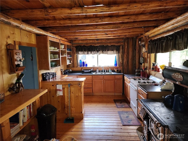 266 Bluebell Ln, Tonasket, WA 98855 - kitchen featuring white range with gas stovetop, light wood-type flooring, wood ceiling with exposed beams, open shelves, and a sink