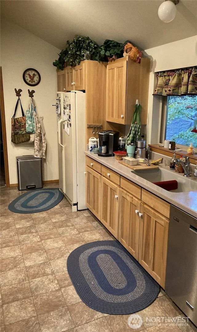 21 N Beaver Pl N, Hoodsport, WA 98548 - kitchen with stainless steel dishwasher, freestanding refrigerator, a sink, light countertops, and lofted ceiling
