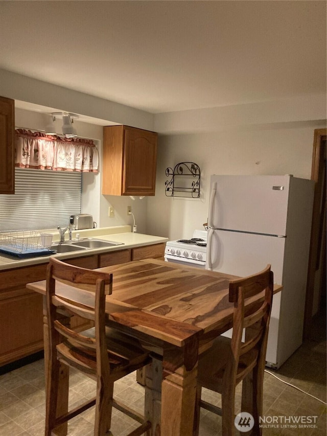 21 N Beaver Pl N, Hoodsport, WA 98548 - kitchen with white appliances, a sink, and light countertops