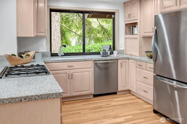 9340 Mercerwood Dr, Mercer Island, WA 98040 - kitchen with appliances with stainless steel finishes, a sink, and light wood-style flooring