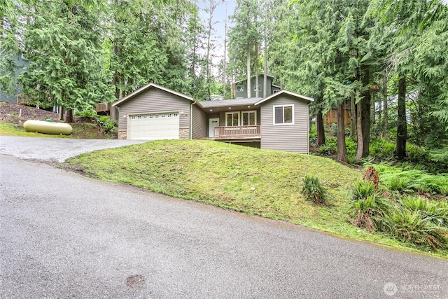 26 Inglewood Pl, Bellingham, WA 98229 - view of front of home with driveway, an attached garage, a front yard, and covered porch
