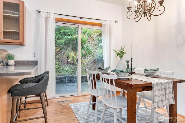 26 Inglewood Pl, Bellingham, WA 98229 - dining area featuring light wood finished floors and a chandelier