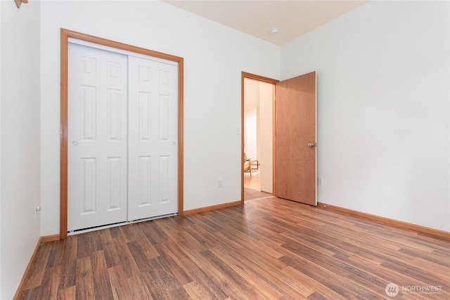 26 Inglewood Pl, Bellingham, WA 98229 - unfurnished bedroom featuring wood finished floors, baseboards, and a closet