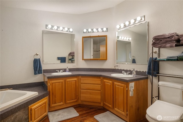 200 N Hamma Hamma Dr W, Hoodsport, WA 98548 - full bathroom with double vanity, a garden tub, toilet, and wood finished floors