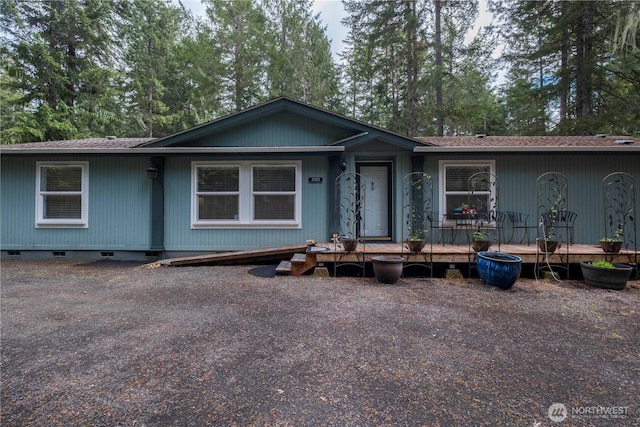 200 N Hamma Hamma Dr W, Hoodsport, WA 98548 - manufactured / mobile home with roof with shingles, a wooden deck, view of wooded area, and crawl space