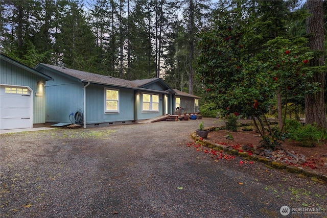 200 N Hamma Hamma Dr W, Hoodsport, WA 98548 - view of front of house featuring crawl space, dirt driveway, a garage, and view of scattered trees