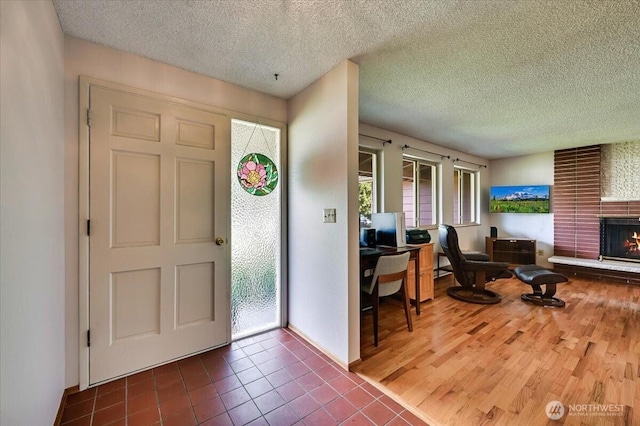 21918 83rd Ave W, Edmonds, WA 98026 - tiled entryway featuring a fireplace and a textured ceiling