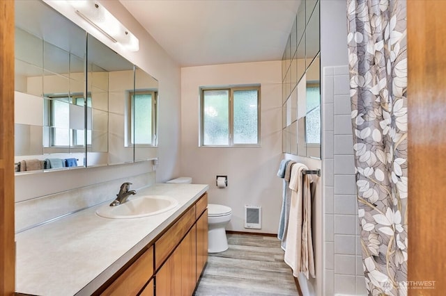 21918 83rd Ave W, Edmonds, WA 98026 - bathroom featuring toilet, vanity, wood finished floors, curtained shower, and heating unit