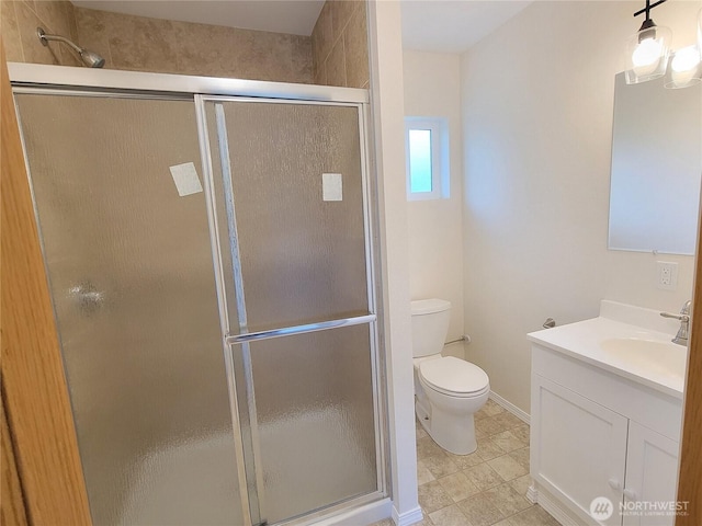 2917 Tierney St SW, Olympia, WA 98512 - bathroom with a shower stall, vanity, toilet, and baseboards