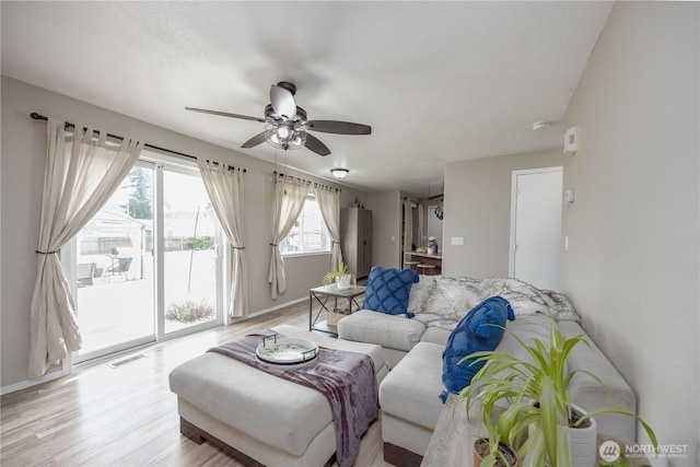 307 E Wilson St, Yacolt, WA 98675 - living area with ceiling fan, light wood-style flooring, and baseboards