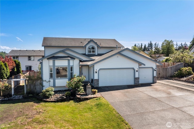 8618 196th Street Ct E, Spanaway, WA 98387 - view of front of home with driveway, a garage, and roof with shingles