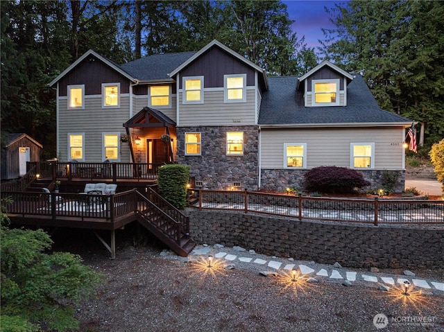 4565 Harper Hill Rd SE, Port Orchard, WA 98366 - view of front of home featuring a deck, stone siding, board and batten siding, stairway, and a shingled roof