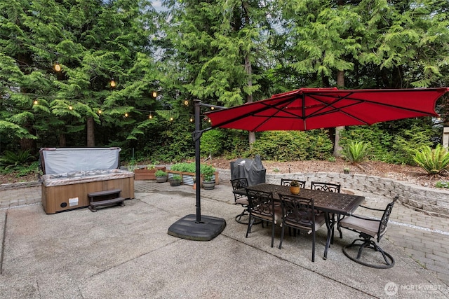 4565 Harper Hill Rd SE, Port Orchard, WA 98366 - view of patio with a hot tub, outdoor dining space, grilling area, and view of wooded area