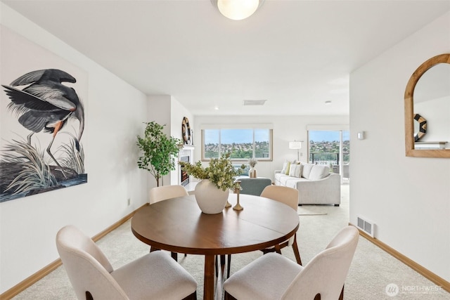 2040 13th Ave W Unit 41, Seattle, WA 98119 - dining room featuring carpet and baseboards