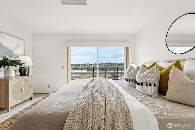 2040 13th Ave W Unit 41, Seattle, WA 98119 - bedroom with access to outside and light carpet