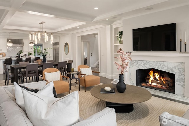 3719 E Highland Dr, Seattle, WA 98112 - living area featuring a premium fireplace, stairs, recessed lighting, ornamental molding, and built in shelves