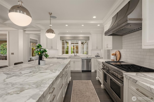 3719 E Highland Dr, Seattle, WA 98112 - kitchen featuring stainless steel appliances, wall chimney exhaust hood, light stone countertops, white cabinetry, and decorative backsplash