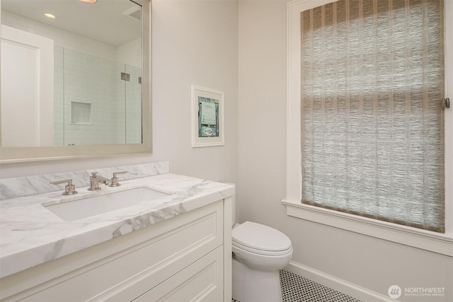 3719 E Highland Dr, Seattle, WA 98112 - bathroom with toilet, a shower stall, vanity, recessed lighting, and baseboards