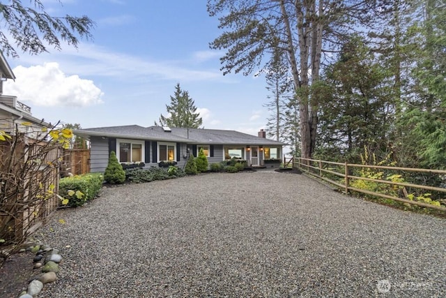 10220 NE Lafayette Ave, Bainbridge Island, WA 98110 - view of front facade with gravel driveway and a chimney