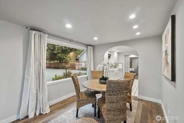10220 NE Lafayette Ave, Bainbridge Island, WA 98110 - dining area with arched walkways, wood finished floors, baseboards, and recessed lighting