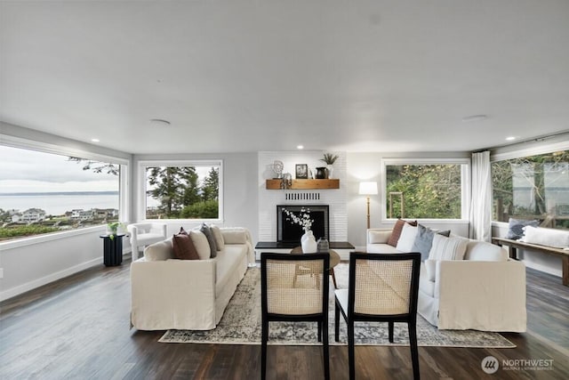 10220 NE Lafayette Ave, Bainbridge Island, WA 98110 - living area featuring a brick fireplace, dark wood-style flooring, baseboards, and recessed lighting