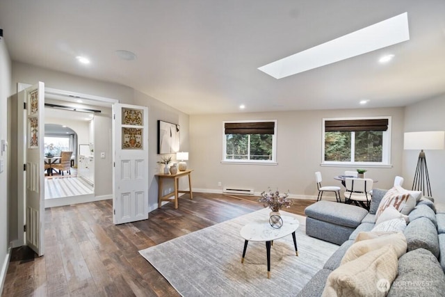 10220 NE Lafayette Ave, Bainbridge Island, WA 98110 - living room featuring a baseboard radiator, a skylight, dark wood-type flooring, healthy amount of natural light, and recessed lighting
