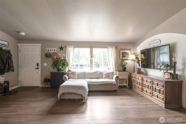 1707 Bonnie Ln, Camano Island, WA 98282 - living area with wood finished floors, a textured ceiling, and baseboards