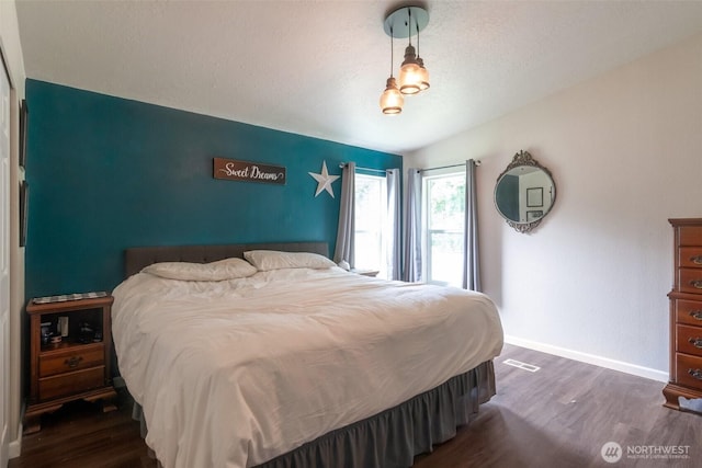 1707 Bonnie Ln, Camano Island, WA 98282 - bedroom featuring wood finished floors, baseboards, and a textured ceiling