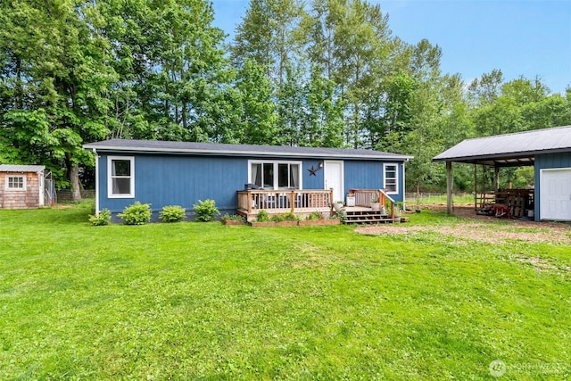 1707 Bonnie Ln, Camano Island, WA 98282 - rear view of house with a wooden deck, a lawn, and a detached carport