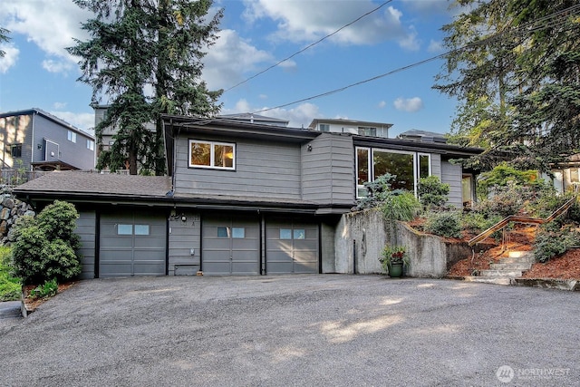18527 Butternut Rd, Lynnwood, WA 98037 - view of front of house with a garage and driveway