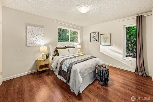 18527 Butternut Rd, Lynnwood, WA 98037 - bedroom with multiple windows, wood finished floors, and a textured ceiling