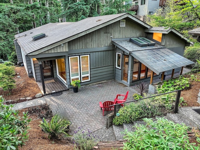 18527 Butternut Rd, Lynnwood, WA 98037 - rear view of house featuring a patio area and roof with shingles