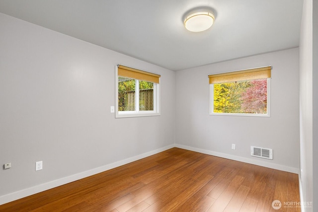 18527 Butternut Rd, Lynnwood, WA 98037 - spare room with baseboards and wood finished floors