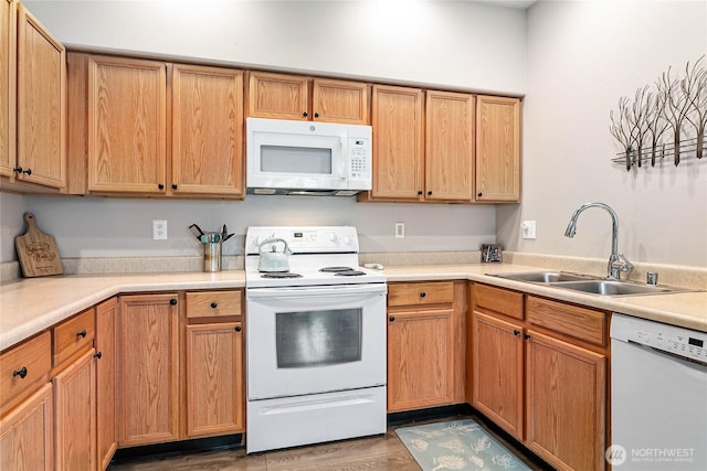 1305 Boon St Unit 112, Sumas, WA 98295 - kitchen featuring white appliances, a sink, light countertops, and wood finished floors