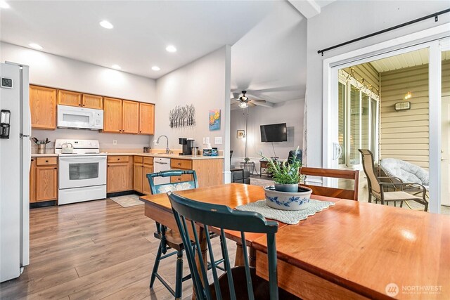 1305 Boon St Unit 112, Sumas, WA 98295 - kitchen with white appliances, a sink, a ceiling fan, light wood-style floors, and light countertops