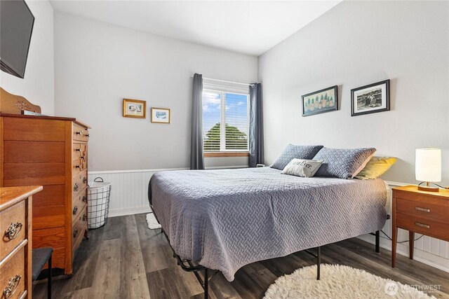 1305 Boon St Unit 112, Sumas, WA 98295 - bedroom with dark wood-type flooring and a wainscoted wall