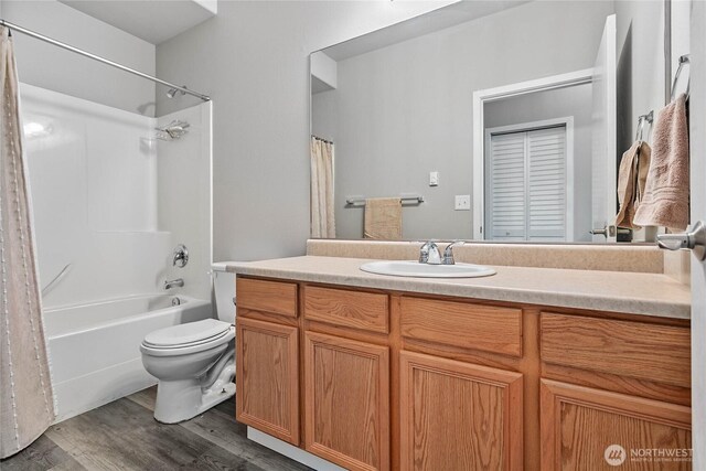 1305 Boon St Unit 112, Sumas, WA 98295 - bathroom with wood finished floors, vanity, toilet, and shower / bathtub combination with curtain