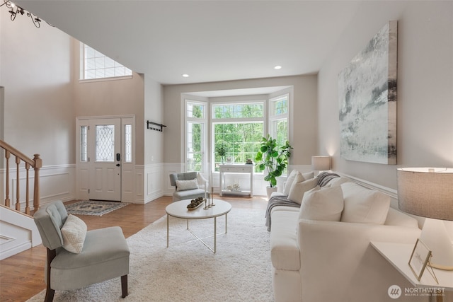 3831 171st Ave SE, Snohomish, WA 98290 - living area with wood finished floors, a wainscoted wall, stairway, recessed lighting, and a decorative wall