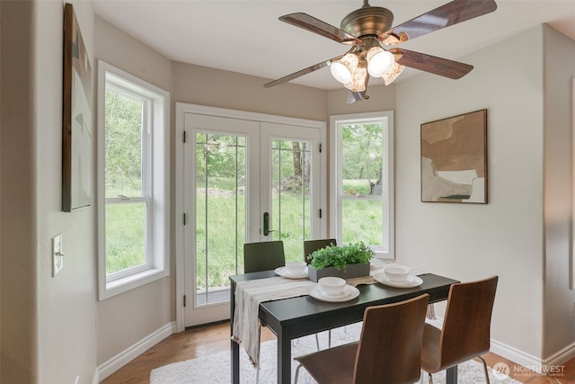 3831 171st Ave SE, Snohomish, WA 98290 - dining area with baseboards, light wood finished floors, and ceiling fan