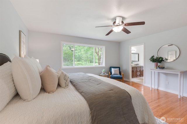 3831 171st Ave SE, Snohomish, WA 98290 - bedroom with light wood finished floors, baseboards, ensuite bathroom, and a ceiling fan