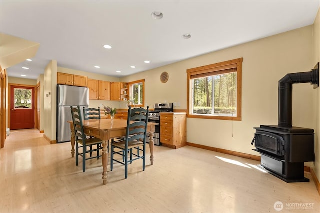 18 Deer Run Loop Rd, Winthrop, WA 98862 - dining space featuring light wood finished floors, recessed lighting, baseboards, and a wood stove