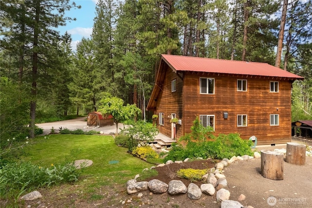 18 Deer Run Loop Rd, Winthrop, WA 98862 - view of side of home featuring a lawn and metal roof