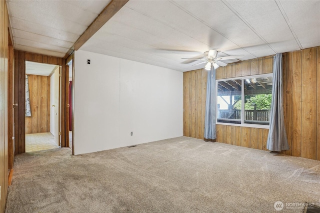 10132 228th Pl SE, Woodinville, WA 98077 - spare room with wood walls, carpet, and ceiling fan