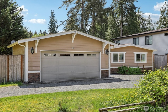 10132 228th Pl SE, Woodinville, WA 98077 - single story home with stone siding, a garage, and gravel driveway