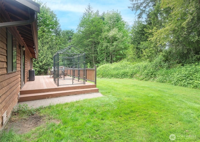 5707 316th St NW, Stanwood, WA 98292 - view of green lawn with a wooden deck and a gazebo