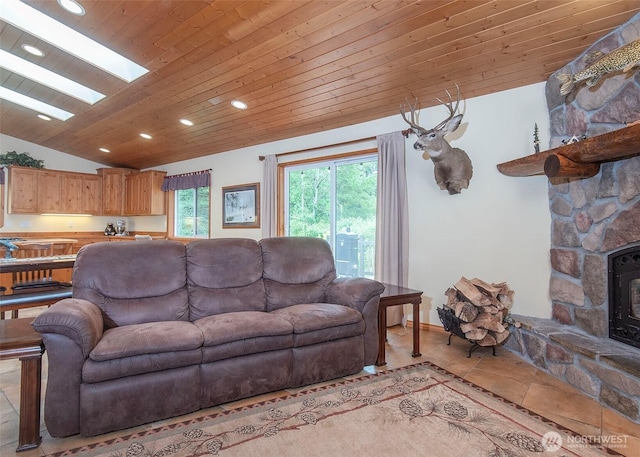 5707 316th St NW, Stanwood, WA 98292 - living room with lofted ceiling, wooden ceiling, recessed lighting, a wood stove, and light tile patterned floors