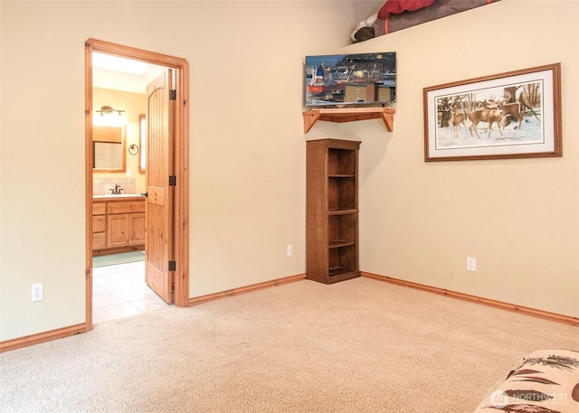 5707 316th St NW, Stanwood, WA 98292 - unfurnished bedroom with carpet, baseboards, a sink, and ensuite bath