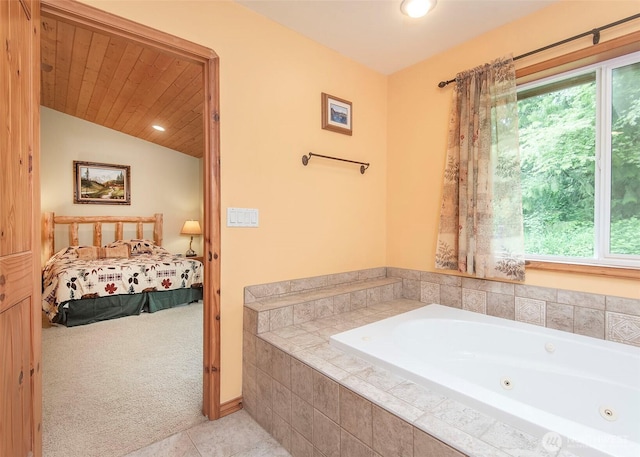 5707 316th St NW, Stanwood, WA 98292 - full bath featuring healthy amount of natural light, tile patterned flooring, a tub with jets, ensuite bath, and lofted ceiling