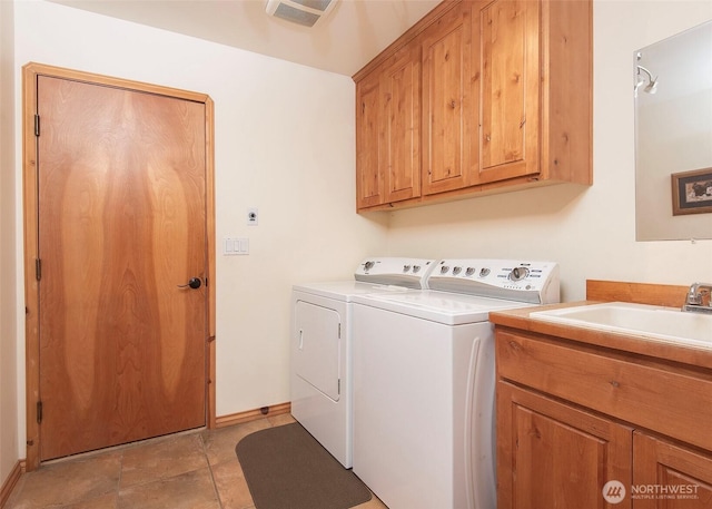 5707 316th St NW, Stanwood, WA 98292 - laundry room with washing machine and dryer, cabinet space, and baseboards
